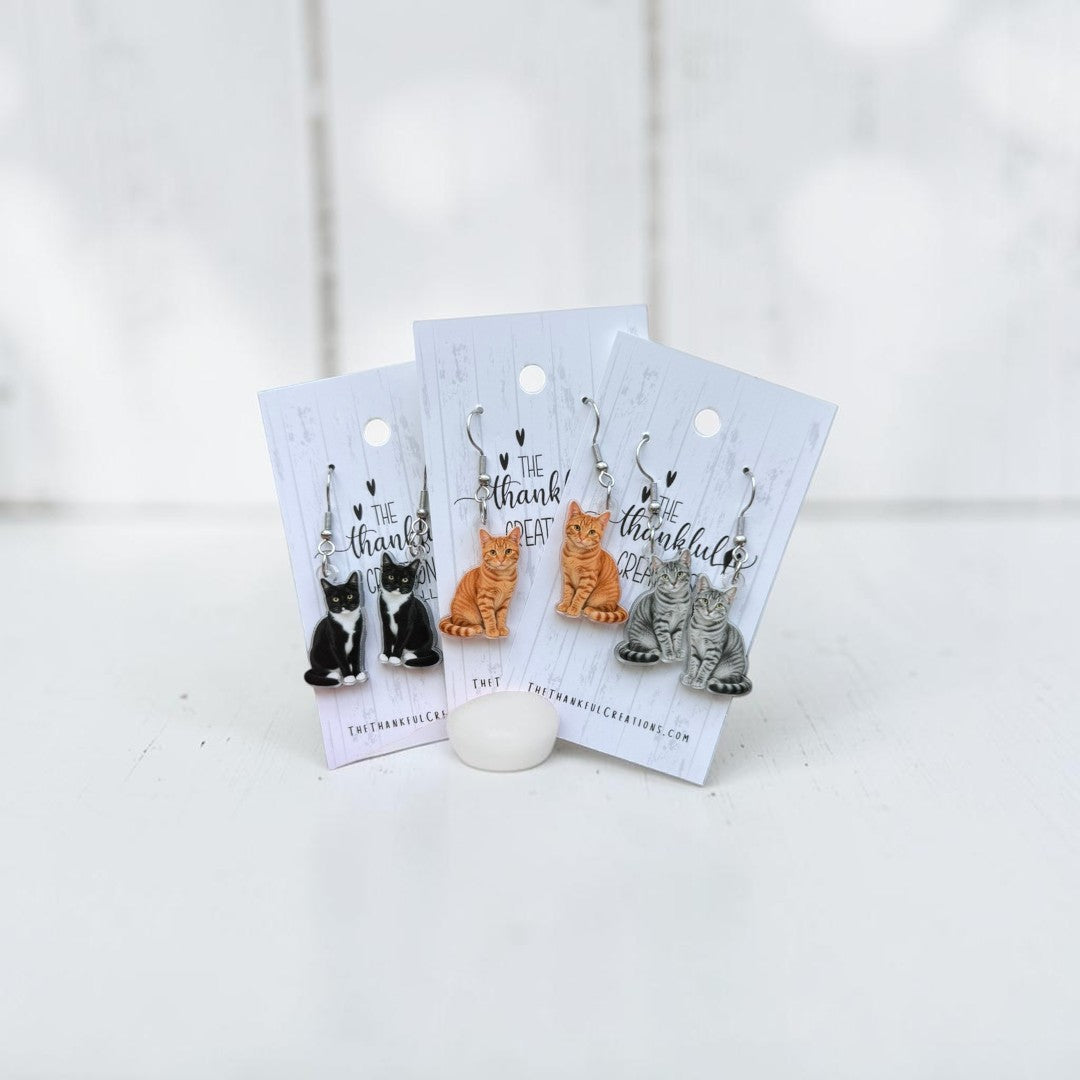 Cat earrings handmade from colorful acrylic with a cute feline design for cat lovers.