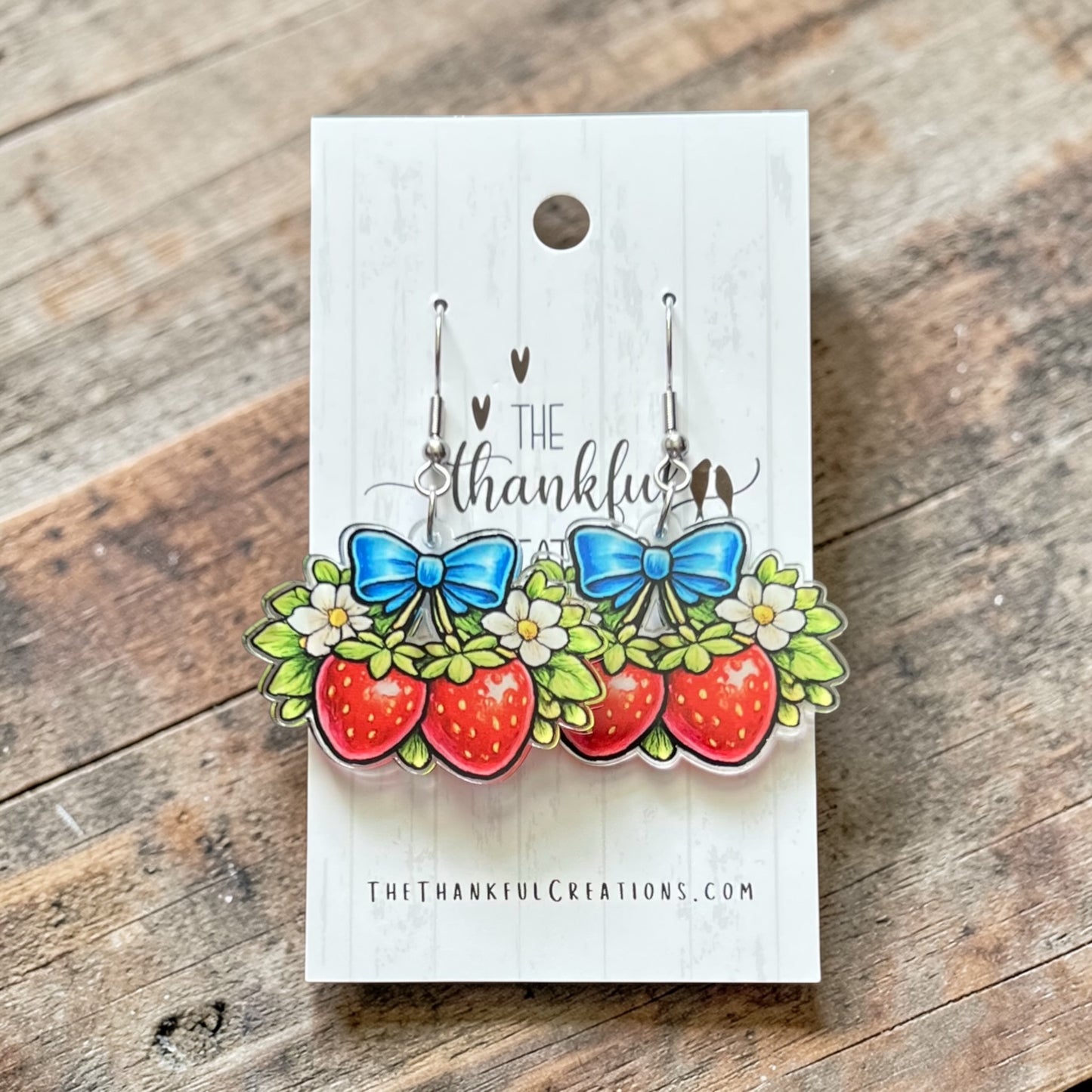 Handmade strawberry bow earrings UV printed on clear acrylic with flowers and blue bow lightweight fruit jewelry