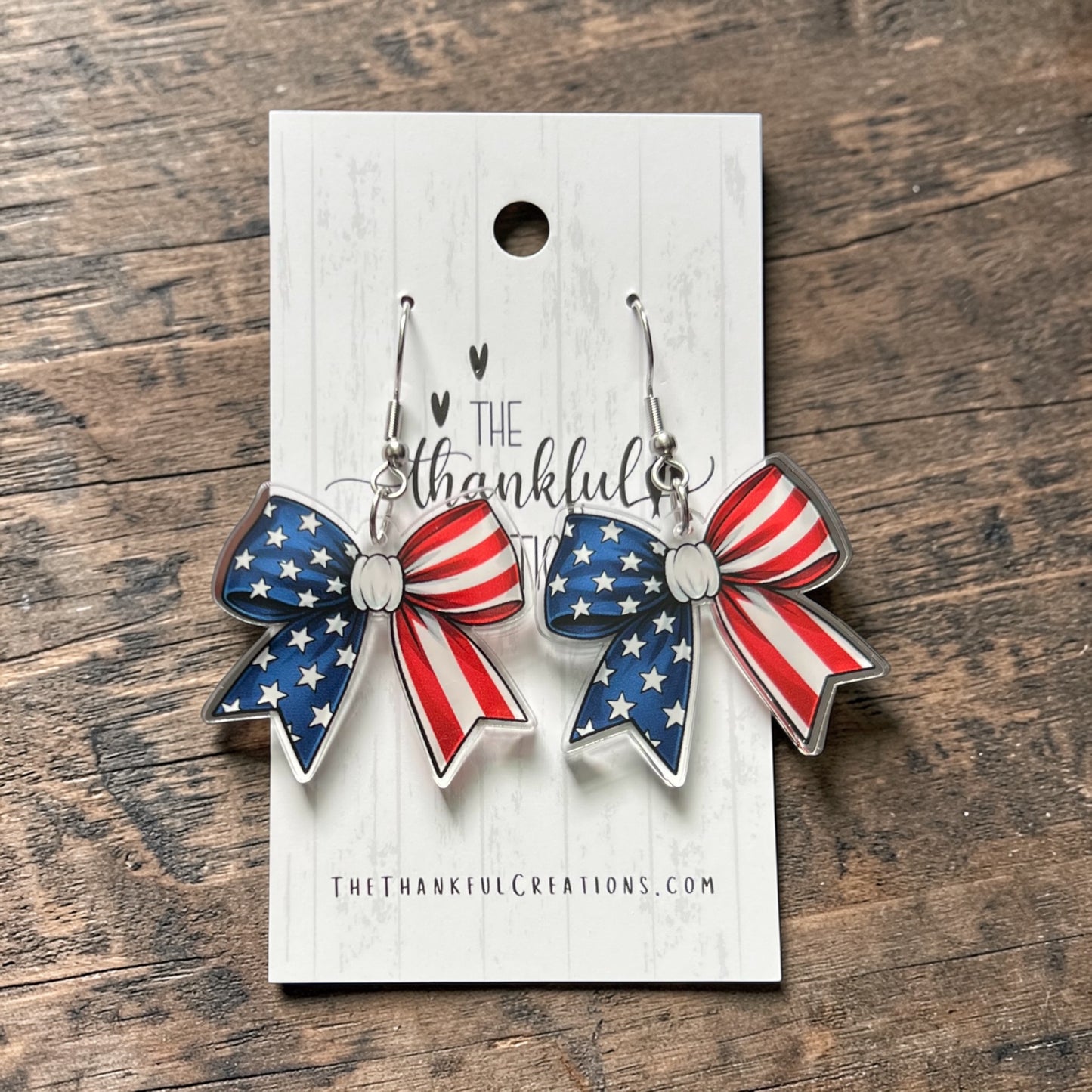 Patriotic American flag bow earrings UV printed on clear acrylic red white and blue USA 250 anniversary jewelry