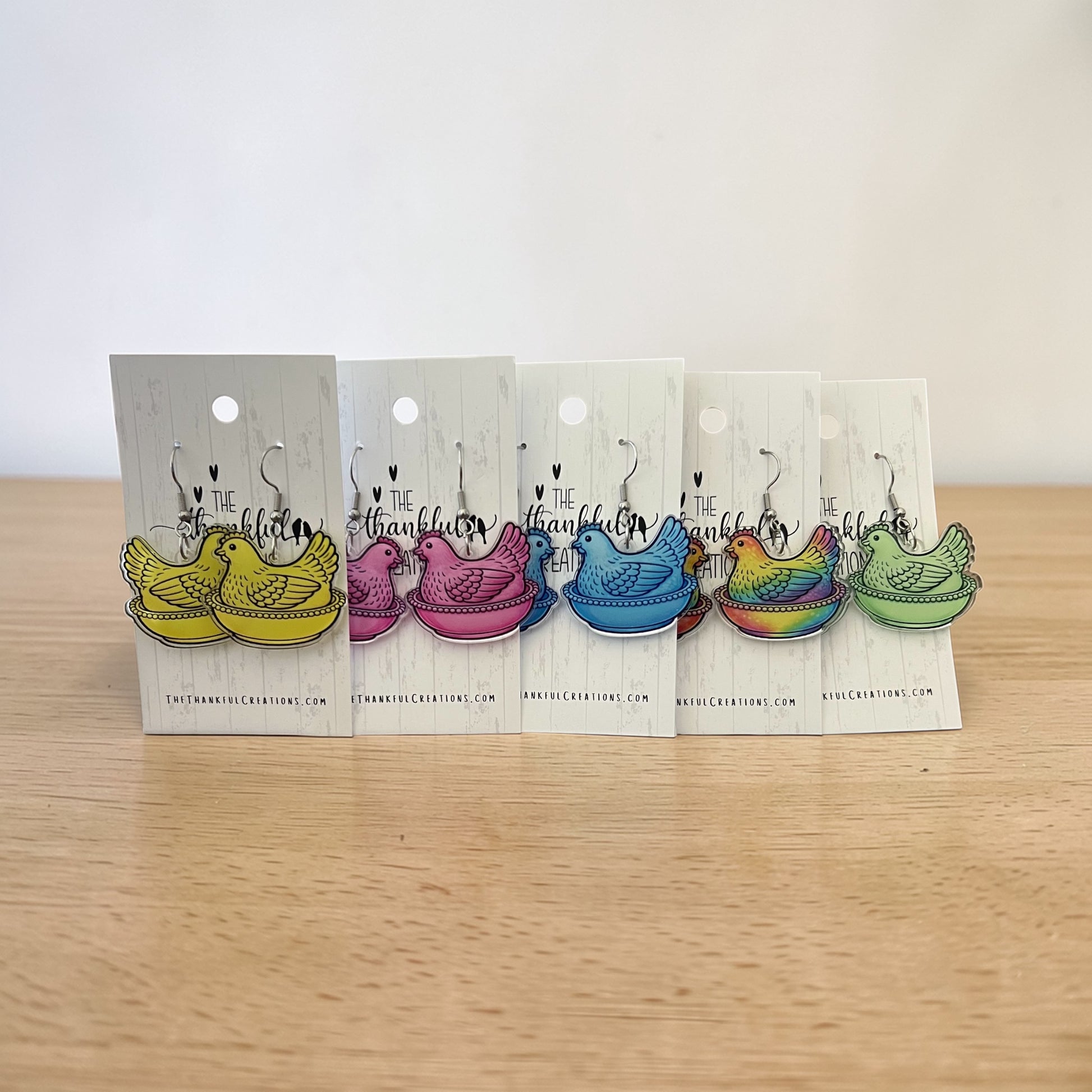 Vintage hen on nest chicken earrings in multiple colors displayed on farmhouse style cards