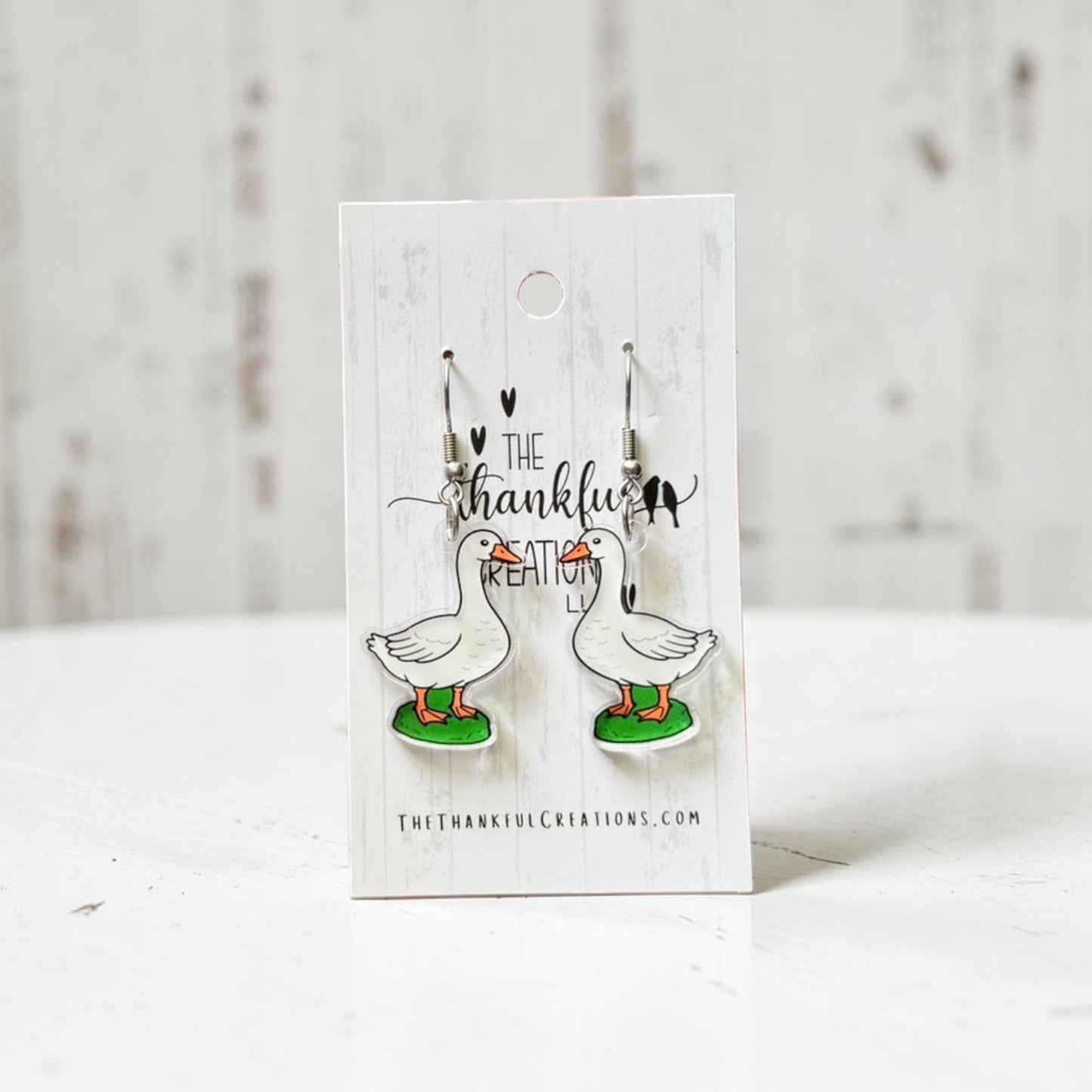porch goose acrylic dangle earrings on clear acrylic with stainless steel hooks, cottagecore farmhouse inspired handmade jewelry