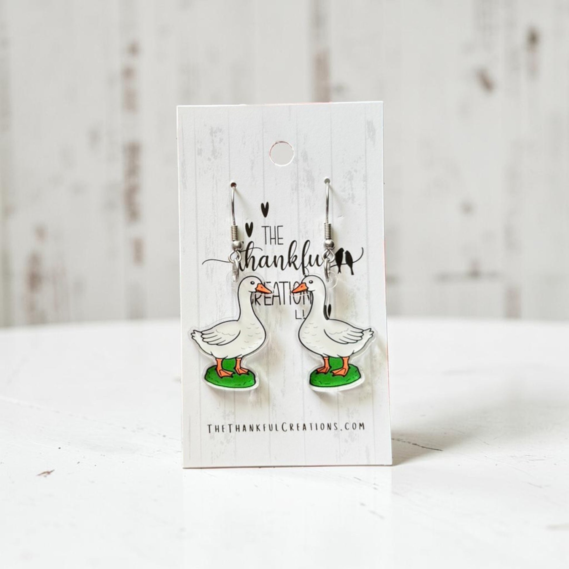 porch goose acrylic dangle earrings on clear acrylic with stainless steel hooks, cottagecore farmhouse inspired handmade jewelry